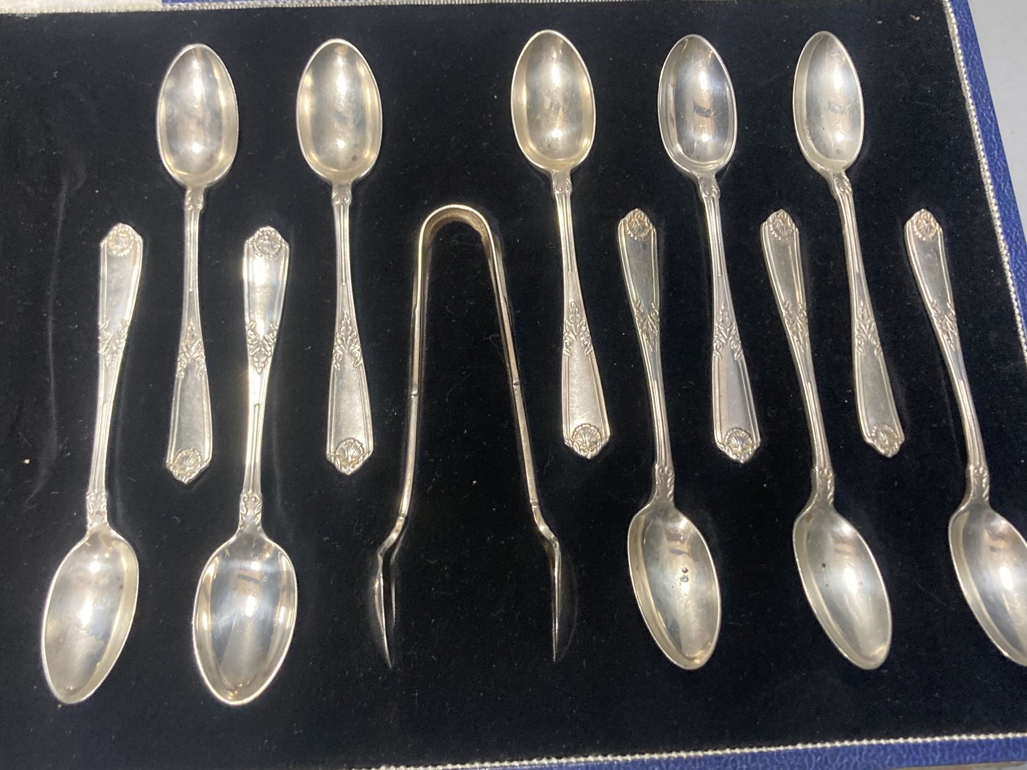 A cased set of six 1950s silver teaspoons, one other incomplete silver set and other flatware.